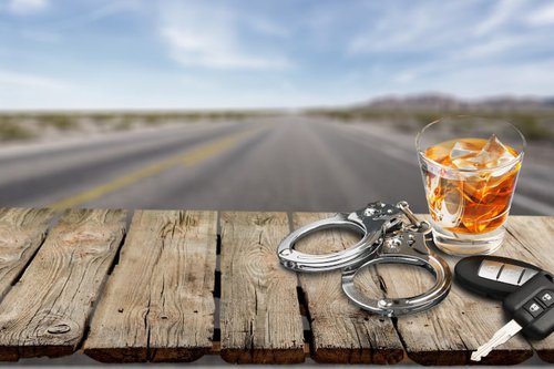 impaired-driving-concept-whiskey-glass-on-road
