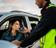 young-woman-breathing-into-breathalyzer